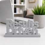 Energy meets execution. This bold yellow, 3D-printed "Results Driven" desk plaque is designed for high-velocity teams that live by their KPIs. Ideal for sales floors, marketing agencies, and software development sprints, this premium sign adds a splash of motivation and modern tech style to any workstation.