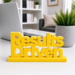 Energy meets execution. This bold yellow, 3D-printed "Results Driven" desk plaque is designed for high-velocity teams that live by their KPIs. Ideal for sales floors, marketing agencies, and software development sprints, this premium sign adds a splash of motivation and modern tech style to any workstation.